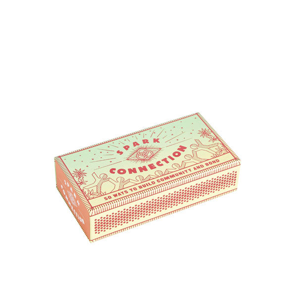 Decorative green and orange Spark Connection matchbox with illustration of flowers and a paper doll chain