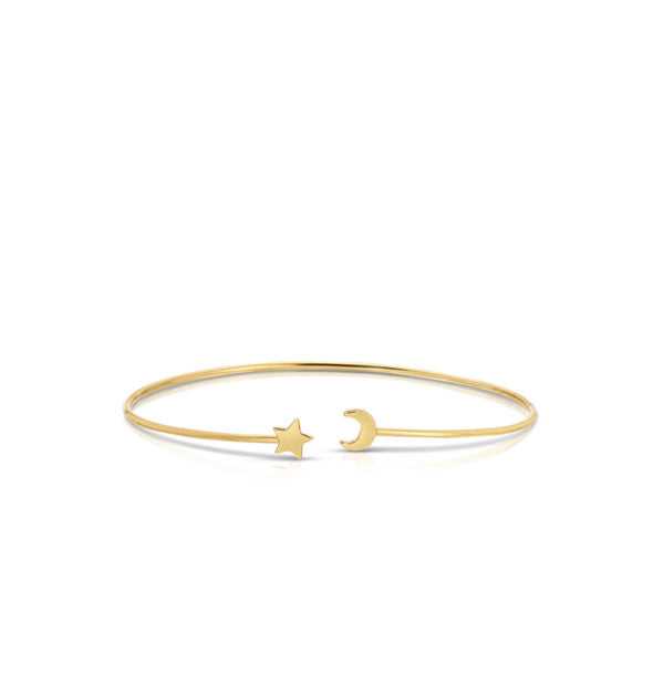 Thin gold cuff-style bracelet with star and moon charms on each open end