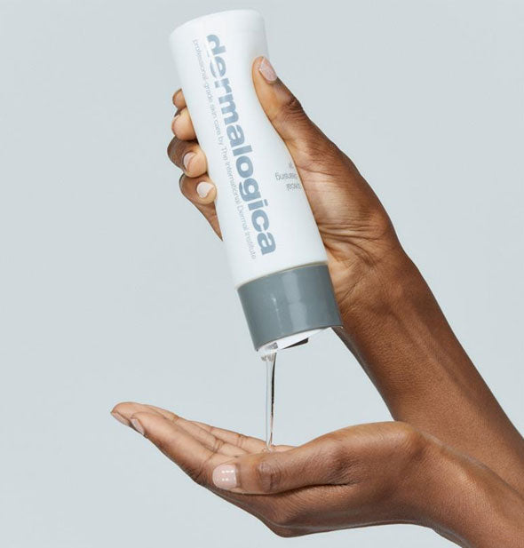 Model pours Dermalogica Special Cleansing Gel from bottle into hand