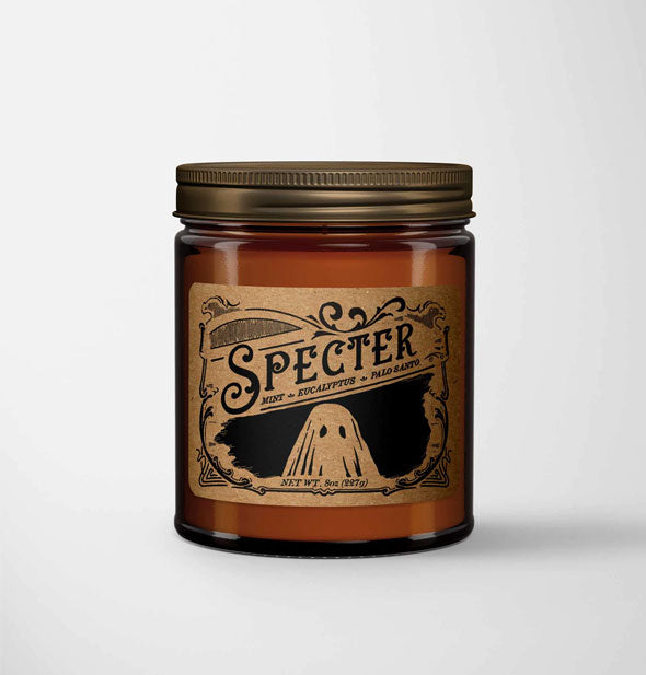 Specter candle in amber glass jar with metal lid features a kraft paper label in a vintage style with ghost illustration