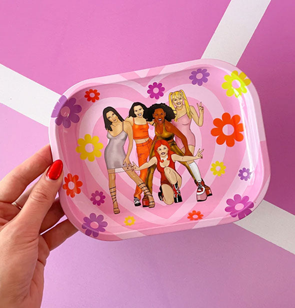 Model's hand holds the Spice Girls tray for size reference