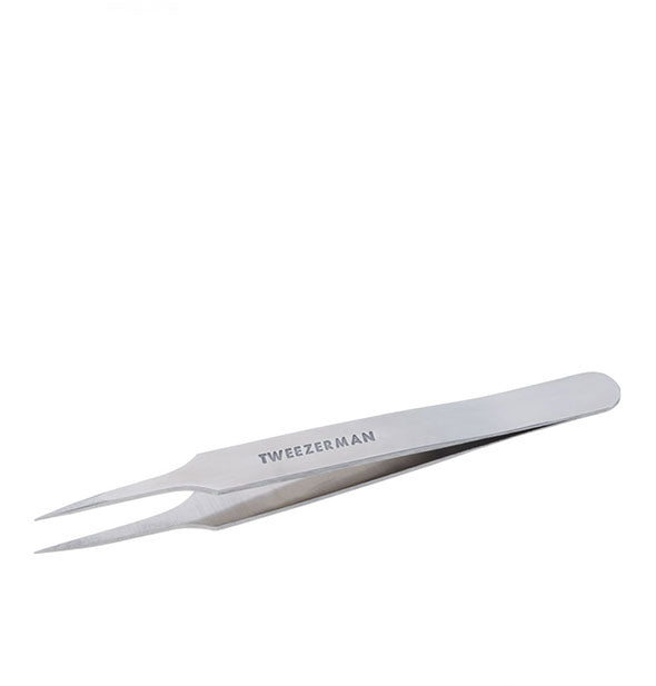 Stainless steel Tweezerman tweezer with stamped logo features elongated pointed tips