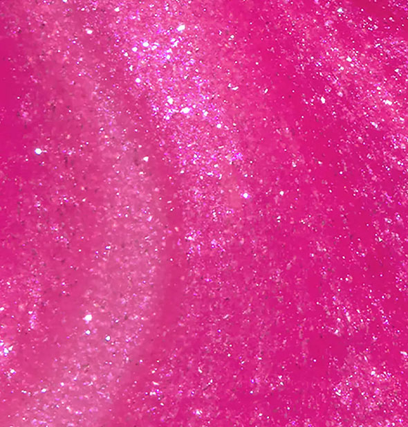 Closeup of sparkling dark pink nail polish