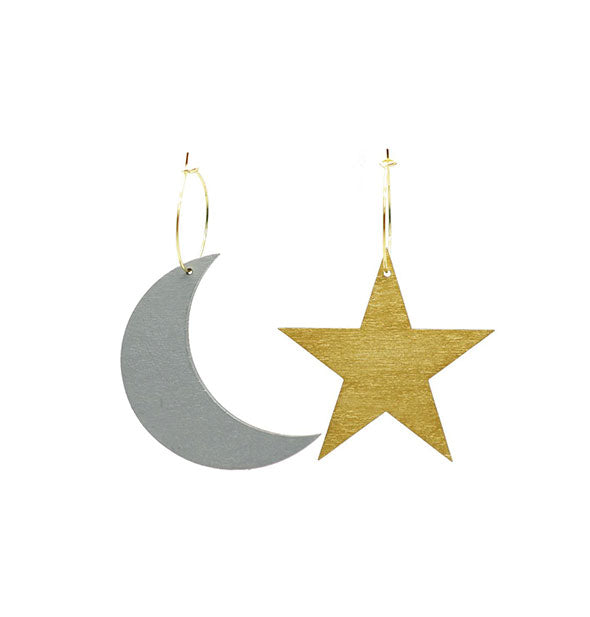 Silver crescent moon and gold star earrings on gold hoops