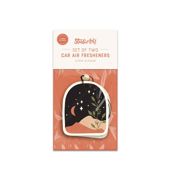 Pack of two car air fresheners by Studio Oh! featuring a starry night sky scene with mountains, a crescent moon, and botanicals