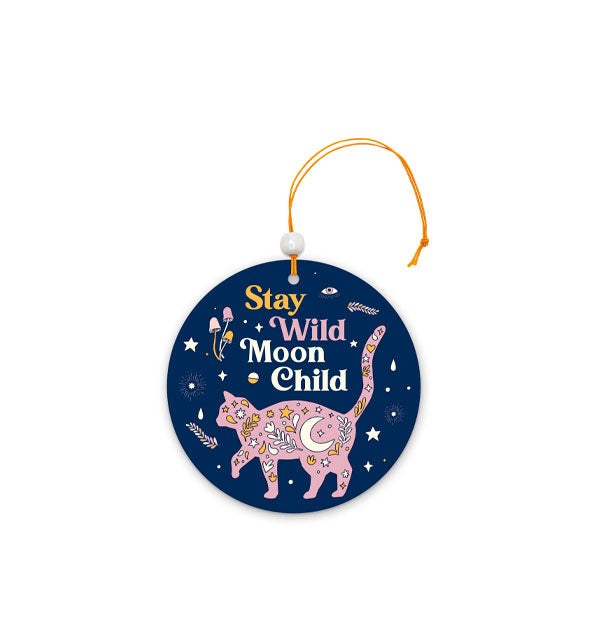 Round dark blue car air freshener with celestial and botanical illustrations in and around pink cat silhouette says, "Stay Wild Moon Child"