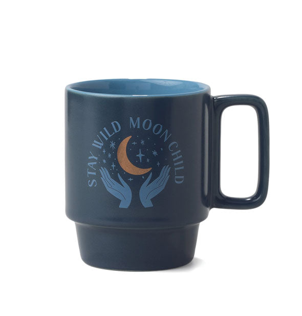 Dark blue mug with lighter blue interior, squared handle, and "Stay Wild, Moon Child" design with gold crescent moon accent features a stackable design