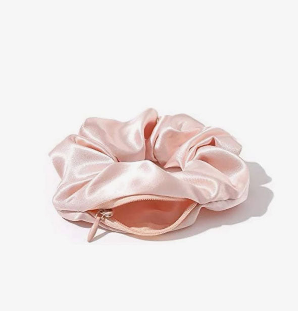 Pink satin hair scrunchie with zipper storage pocket