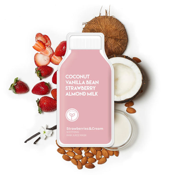 Pink bottle-shaped Strawberries & Cream sheet mask pack rests on top of coconut and strawberry pieces, a vanilla flower, and a glass of milk