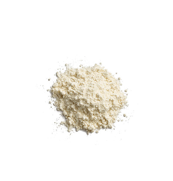 Small pile of Eminence Organics Strawberry Rhubarb Dermafoliant granules