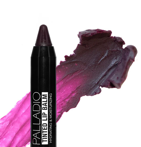 Stick of Palladio Tinted Lip Balm with pointed tip and sample application behind in the shade Sugar Plum