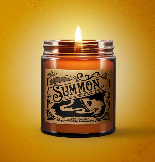 Lit Summon candle on yellow backdrop