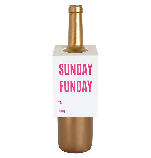 White card hanging on the shoulder of a gold wine bottle says, "Sunday Funday" in large pink lettering