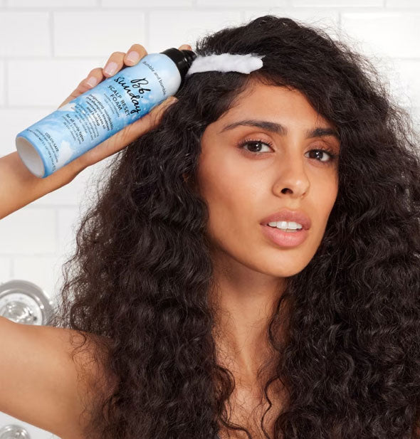 Model demonstrates use of Bumble and bumble's Sunday Scalp Reset Foam