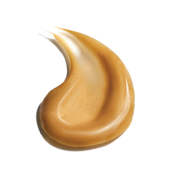 Sample dollop of golden self-tanning product with slight shimmer