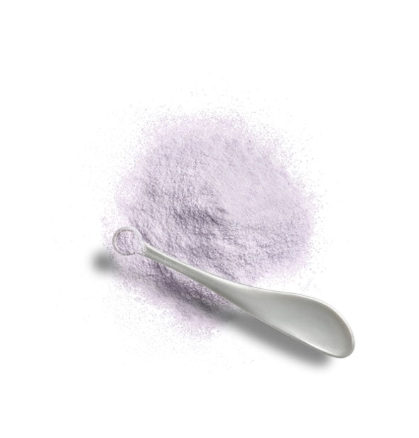 Small pile of fine purple powder with a gray spoon