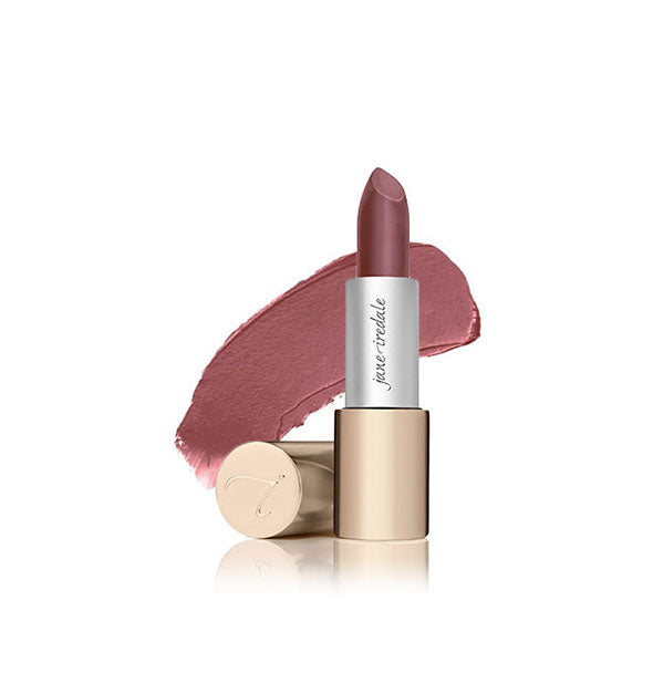 Tube of Jane Iredale lipstick with cap removed and sample swatch behind in the shade Susan