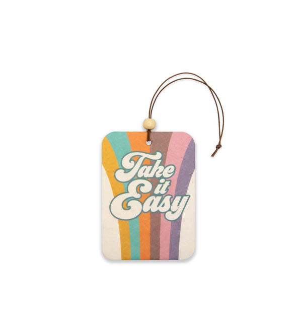 Rectangular car air freshener on brown string with white bead says, "Take It Easy" in white retro-style lettering on a colorfully striped background