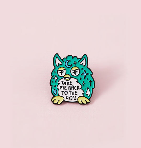 Teal, pink, and yellow Furby enamel pin says, "Take me back to the 90s" in its belly