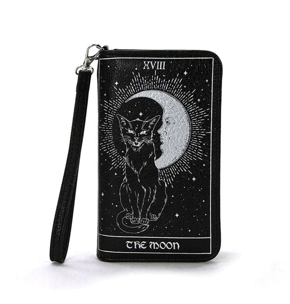 Black rectangular wallet with wrist strap features a silvery design of a cat and gleaming crescent moon in the style of "The Moon" tarot card