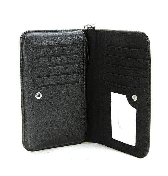 Black wallet interior shows button clasp and card slots