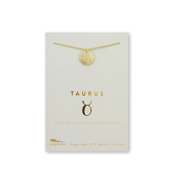 Gold Taurus necklace on card with metallic gold print and symbol
