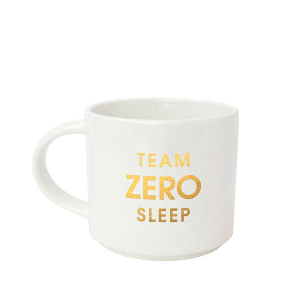 White coffee mug says, "Team Zero Sleep" in metallic gold foil lettering