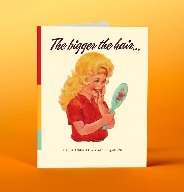 Greeting card with illustration of a smiling blonde child looking into a hand mirror says, "The bigger the hair...the closer to...yaasss queen!"