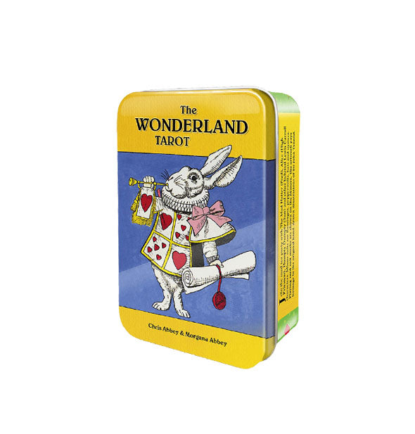 The Wonderland Tarot tin features a central illustration of the White Rabbit