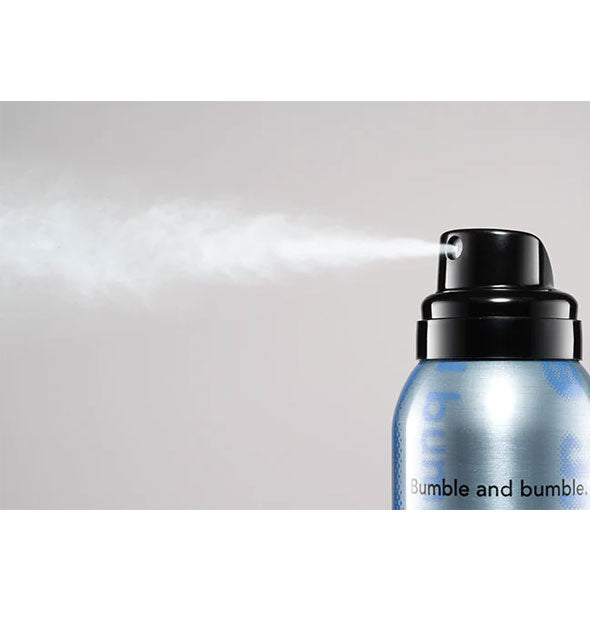 A fine mist is dispensed from a can of Bumble and bumble Thickening Dryspun Texture Spray