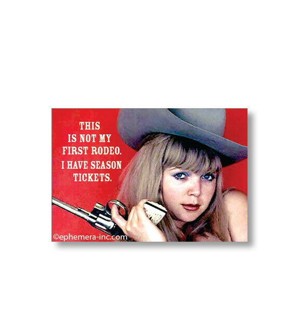 Rectangular magnet with image of a woman wearing a cowboy hat and holding a revolver says, "This is not my first rodeo. I have season tickets."
