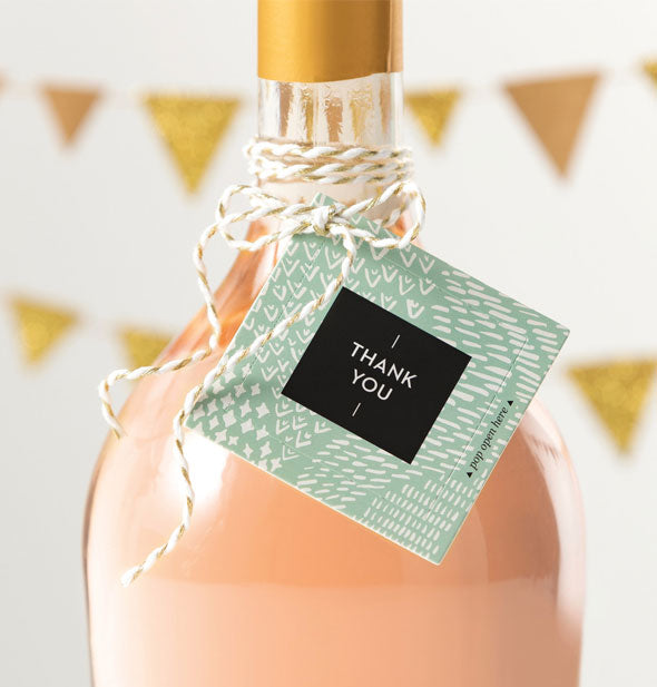 Thank You card is attached to a bottle with twine