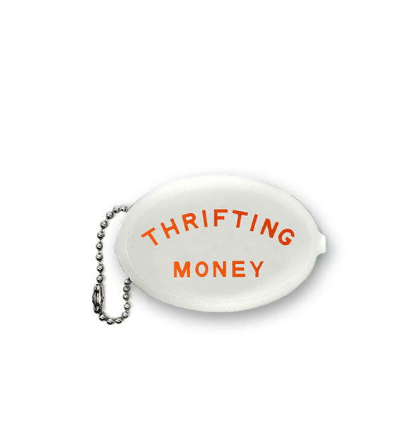 White oval-shaped coin purse with attached bead chain says, "Thrifting Money" in red lettering