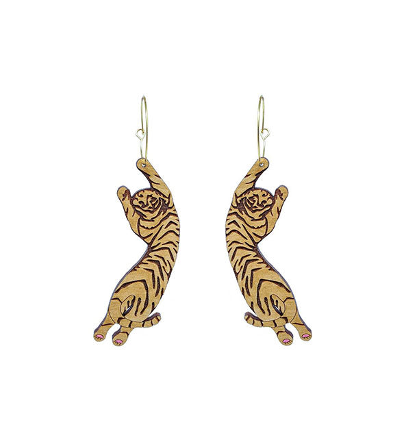 Pair of gold carved tiger earrings on gold hoops