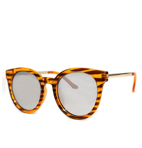Sunglasses with rounded amber tortoise stripe frame and light gray lens