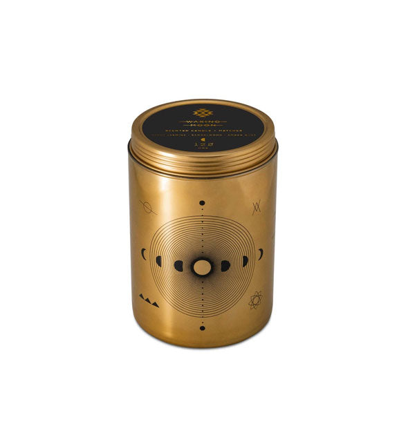 Cylindrical gold candle tin with black silkscreened moon phases design elements