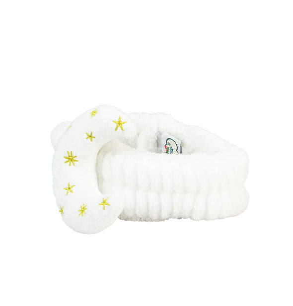 Plush white headband with central moon covered in gold stars