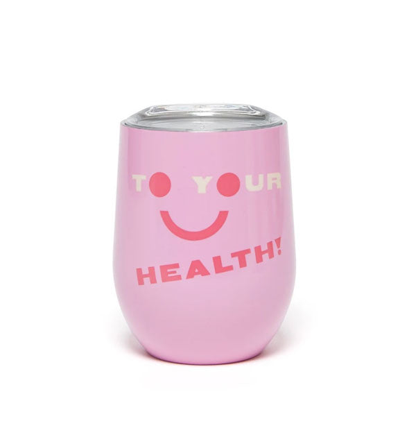 Pink wine tumbler with clear plastic lid says, "To Your Health!" with smiley face incorporated
