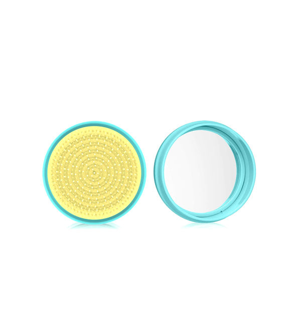 Round turquoise and citron macaron-shaped hairbrush shown open to reveal compact mirror inside