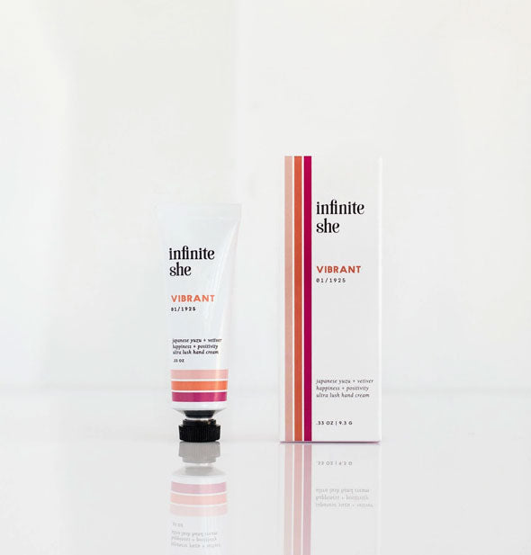 0.33 ounce tube of Infinite She Vibrant Hand Cream with box, both featuring a purple and orange stripe design