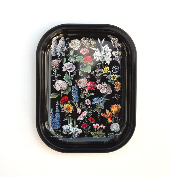 Rectangular black tray with rounded corners features colorful illustrations of flowers