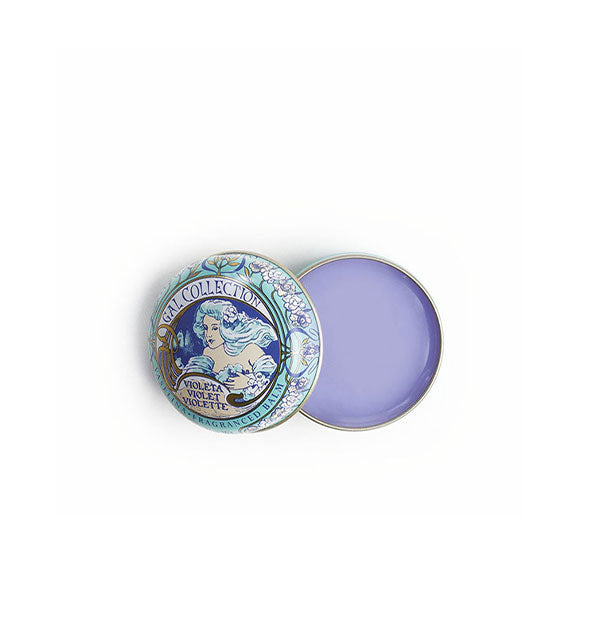Opened round tin of waxy violet Gala Collection lip balm features ornate turn-of-the-century illustration of a draped woman with flowing hair and flowers on its lid