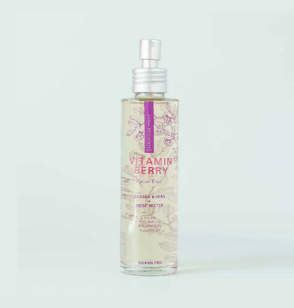 A bottle of Vitamin Berry Facial Tonic with purple design accents and silver spray nozzle