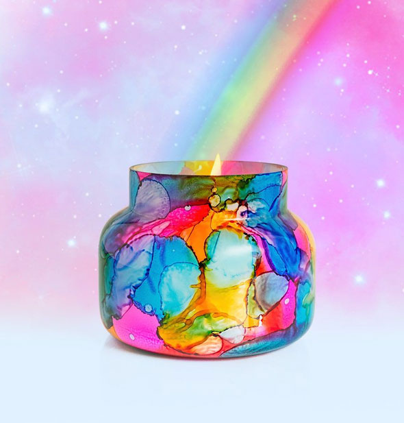 Colorful watercolor-effect jar candle on a starry background with rainbow emanating from its flame within