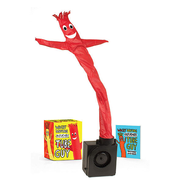 Contents of the Wacky Waving Inflatable Tube Guy kit: red tube guy on black stand, booklet, and box