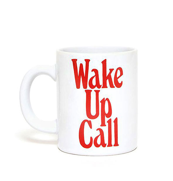 White coffee mug says, "Wake Up Call" in large red lettering