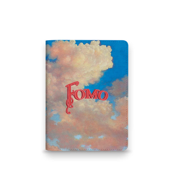 Rectangular passport holder features artwork of billowing clouds in a blue sky with, "FOMO" printed overtop in decorative arced pink lettering