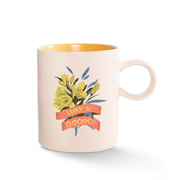 Cream-colored coffee mug with circular handle and yellow interior features illustration of yellow flowers wrapped in a coral banner that says, "WAY to GOOOO!"