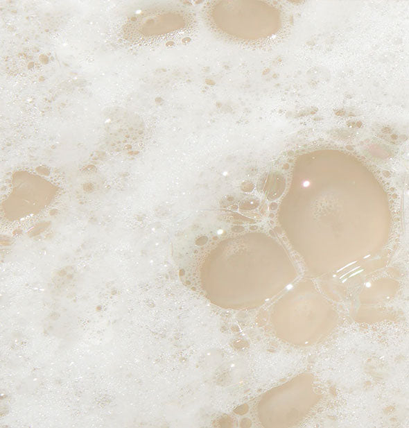 Foamy, bubbly, white shampoo lather