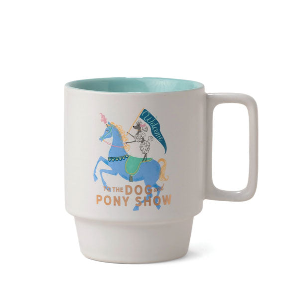 White mug with stackable design, teal interior and squared handle features illustration of a banner-wielding poodle on horseback and the words, "Welcome to the Dog and Pony Show" accented in metallic gold foil